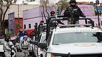 | Photo: AP/Ginette Riquelme : National Guards patrol the area outside of the General Prosecutor's headquarters in Mexico City, Sunday, Feb. 22, 2026, after authorities reported that the Mexican Army killed Jalisco New Generation Cartel leader Nemesio Oseguera Cervantes, known as "El Mencho."