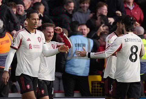 Liverpool's Alexis Mac Allister, second left, celebrates with teammates scoring his side's first goal during the English Premier League soccer match between Nottingham Forest and Liverpool in Nottingham.