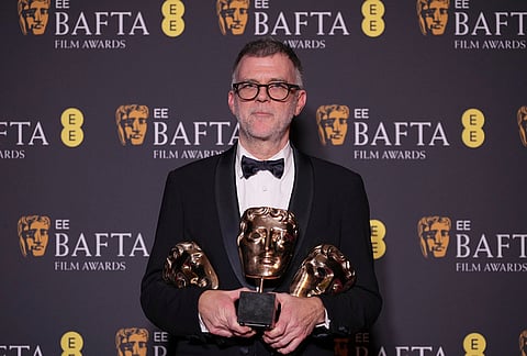Paul Thomas Anderson poses with the awards for best director, cinematography, and adapted screenplay for 'One Battle After Another' at the 79th British Academy Film Awards, BAFTA's, in London.
