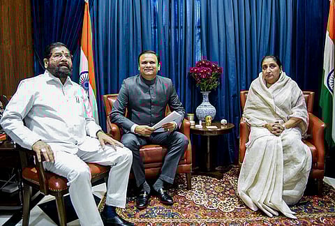 Maharashtra Deputy Chief Minister Eknath Shinde, left, meets Legislative Assembly Speaker Rahul Narvekar, center, ahead of the Budget session, at Vidhan Bhavan, in Mumbai. Deputy Chief Minister Sunetra Pawar is also seen. 