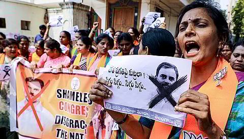 BJP Mahila Morcha activists shout slogans during a protest condemning alleged remarks by Congress youth leaders at AI Impact Summit in New Delhi, in Hyderabad.