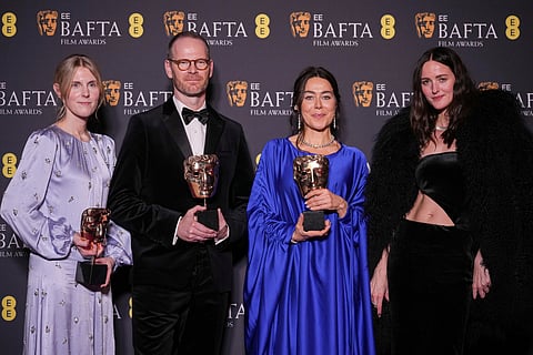 Andrea Berentsen Ottmar, from left, Joachim Trier, Maria Ekerhovd, and Renate Reinsve pose with the award for film not in the English language for 'Sentimental Value' at the 79th British Academy Film Awards, BAFTA's, in London.