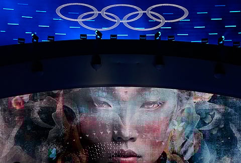 The Olympic rings are illuminated during a performance at the closing ceremony of the 2026 Winter Olympics, in Verona, Italy.