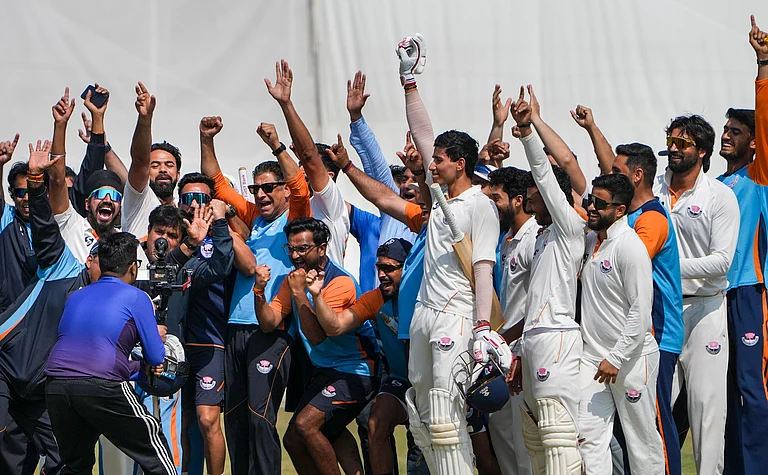 Jammu and Kashmir's Vanshaj Sharma with teammates , seen celebrating after the team's victory in the Ranji Trophy semifinal cricket match against Bengal, at the Bengal Cricket Academy Ground, in Kalyani, West Bengal, Wednesday, Feb. 18, 2026. - PTI