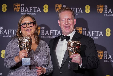 Yvett Merino, left, and Jared Bush pose with the award for animated film for 'Zootopia 2'at the 79th British Academy Film Awards, BAFTA's, in London.