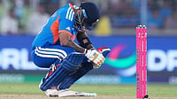 | Photo: AP/Ajit Solanki : India's captain Suryakumar Yadav takes a breather after getting hit by a delivery from South Africa's Lungi Ngidi during the T20 World Cup cricket match between India and South Africa in Ahmedabad, India, Sunday, Feb. 22, 2026.