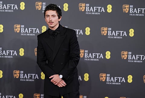 Timothee Chalamet poses for photographers upon arrival at the 79th British Academy Film Awards, BAFTA's, in London.
