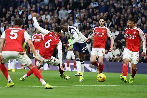 Tottenham's Randal Kolo Muani shoots to score his side's first goal during the English Premier League soccer match between Tottenham Hotspur and Arsenal in London.