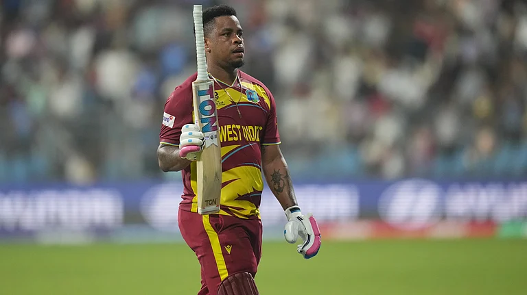 West Indies' Shimron Hetmyer leaves the ground after losing his wicket during the T20 World Cup cricket match between Zimbabwe and West Indies in Mumbai, India, Monday, Feb. 23, 2026. - | Photo: AP/Rafiq Maqbool