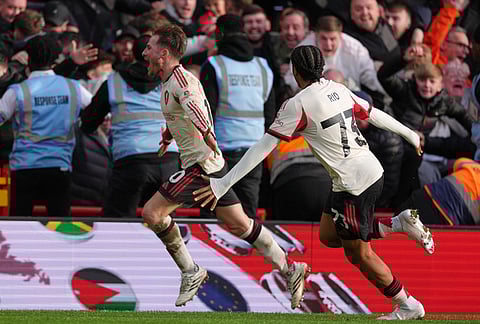 Liverpool's Alexis Mac Allister, left, and Liverpool's Rio Ngumoha celebrate scoring their side's first goal during the English Premier League soccer match between Nottingham Forest and Liverpool in Nottingham.