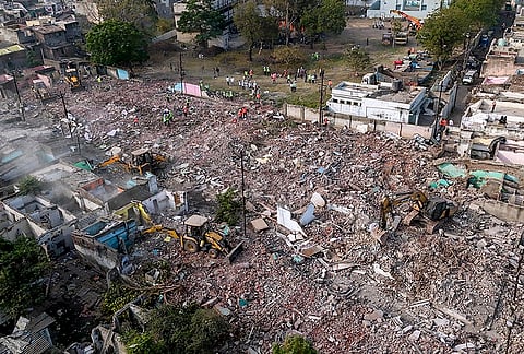An aerial view shows a demolition drive underway to clear illegal houses along the Aji river banks and TP Road at Jangleshwar area, in Rajkot, Gujarat.