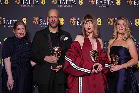 Lauren Frankfort Meltzer, from left, Matt Houghton, Georgie Wileman, and Harriette Wright pose with the award for British short film for 'This Is Endometriosis' at the 79th British Academy Film Awards, BAFTA's, in London.