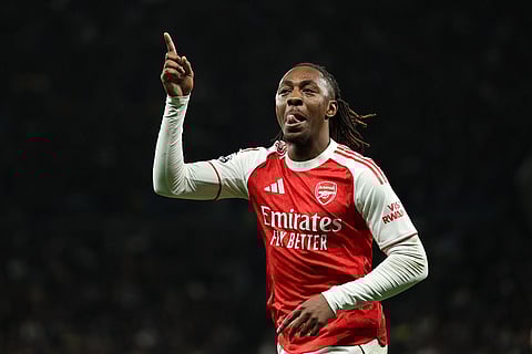 Arsenal's Eberechi Eze celebrates scoring his side's third goal during the English Premier League soccer match between Tottenham Hotspur and Arsenal in London.