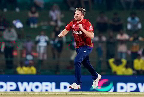England's Liam Dawson celebrates the wicket of Pakistan's Mohammad Nawaz during the T20 World Cup cricket match between England and Pakistan in Pallekele, Sri Lanka.
