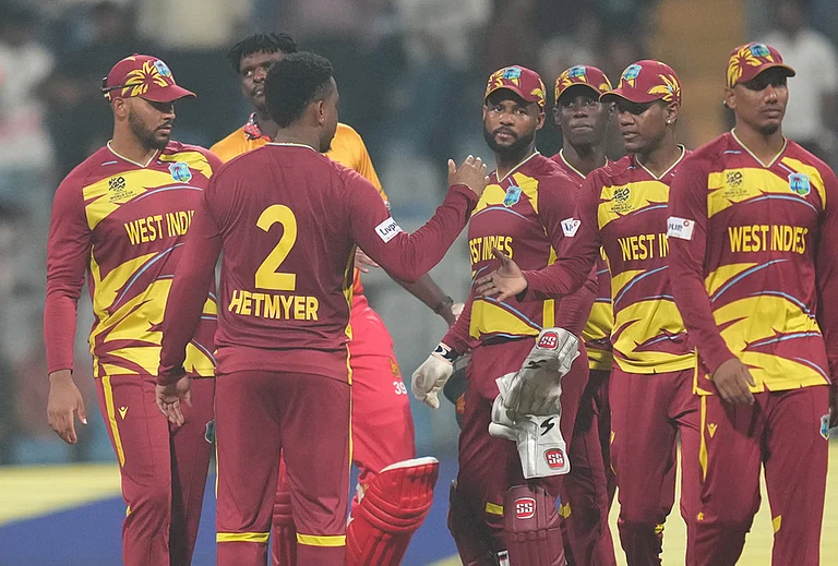 West Indies' Shimron Hetmyer, second from left, celebrates with teammates after their win against Zimbabwe during the T20 World Cup cricket match in Mumbai. - | Photo: AP/Rafiq Maqbool