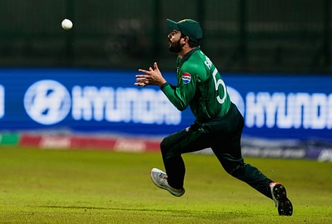 Pakistan's Sahibzada Farhan takes the catch to get England's Jacob Bethell during the T20 World Cup cricket match between England and Pakistan in Pallekele, Sri Lanka.