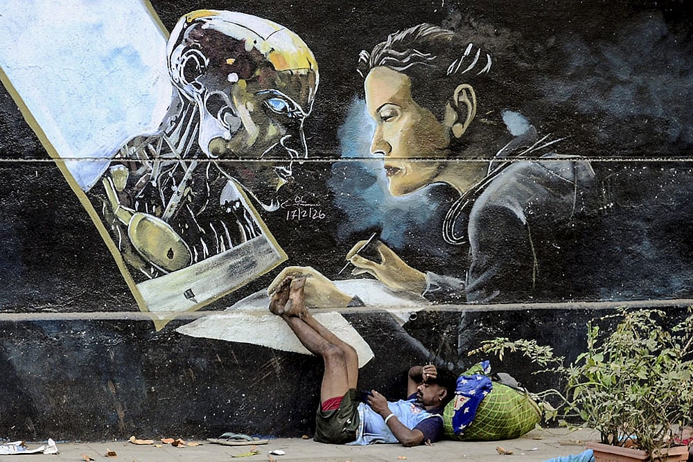 Man sleeps near mural