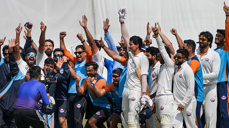 Jammu and Kashmir's Vanshaj Sharma with teammates celebrates after the team's victory in the Ranji Trophy semi-final against Bengal. - Photo: PTI