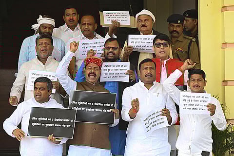 Patna: Rashtriya Janata Dal (RJD) and CPI-ML legislators stage a protest against the Bihar government during the ongoing Budget session of the state Assembly, in Patna, Bihar.