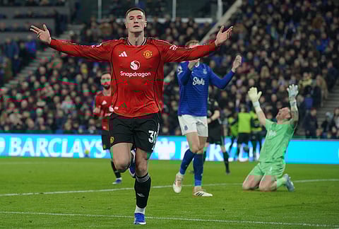 Manchester United's Benjamin Sesko celebrates after scoring during the Premier League soccer match between Manchester United and Everton in Liverpool, England.