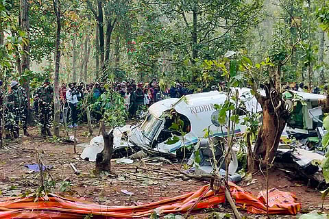 Security officials and locals gather near the wreckage of a Redbird Airways Pvt Ltd Beechcraft C90 air ambulance that crashed near Simaria, in Chatra district, Jharkhand. All seven persons on board were killed after the aircraft went down shortly after taking off from Ranchi for Delhi, according to officials.