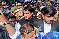 Day In Pics: February 24, 2026 | Photo: PTI : Indian Youth Congress (IYC) national president Uday Bhanu Chib is taken into police custody after a hearing at Patiala House Court in connection with the AI Impact Summit protest case, in New Delhi.