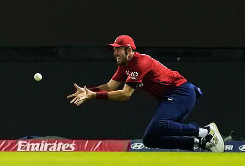 England's Jamie Overton takes the catch to get Pakistan's captain Salman Ali Agha during the T20 World Cup cricket match between England and Pakistan in Pallekele, Sri Lanka.