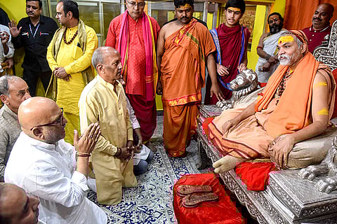 Uttar Pradesh Congress President Ajay Rai with Swami Avimukteshwaranand Saraswati during a meeting, in Varanasi. Saraswati moved the Allahabad High Court on Tuesday seeking anticipatory bail after being booked for alleged sexual harassment of minor children and other offences.