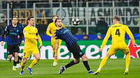 (AP Photo/Luca Bruno) : Inter Milan's Francesco Pio Esposito, center, vies for the ball with Glimt's Odin Bjortuft, right, during a Champions League playoff soccer match between Inter Milan and Bodo Glimt, at the San Siro stadium in Milan, Italy, Tuesday, Feb.24, 2026. 