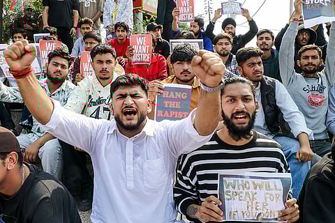 Members of a youth wing shout slogans during a protest over the alleged kidnapping and sexual assault of a minor girl, in Jammu.