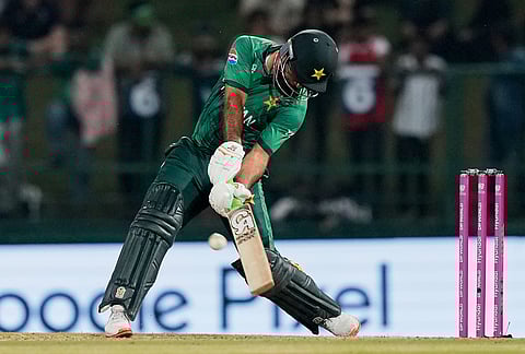 Pakistan's Fakhar Zaman hits a six during the T20 World Cup cricket match between England and Pakistan in Pallekele, Sri Lanka.