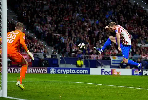 Atletico Madrid's Alexander Sorloth scores his side's fourth goal during the Champions League play-off second leg soccer match between Atletico Madrid and Club Brugge, in Madrid, Spain.