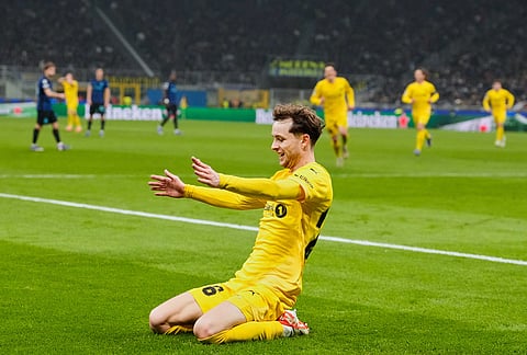 Glimt's Hakon Evjen celebrates after scoring his side's second goal during a Champions League playoff soccer match between Inter Milan and Bodo Glimt, at the San Siro stadium in Milan, Italy.