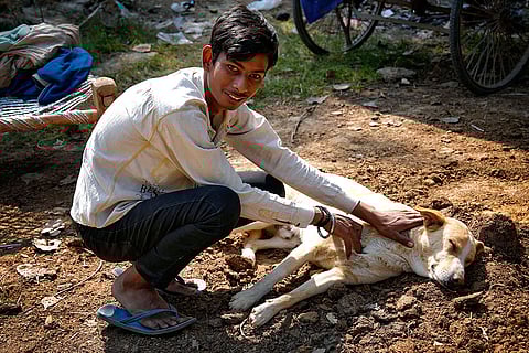 Vikas playing with his pet dog.