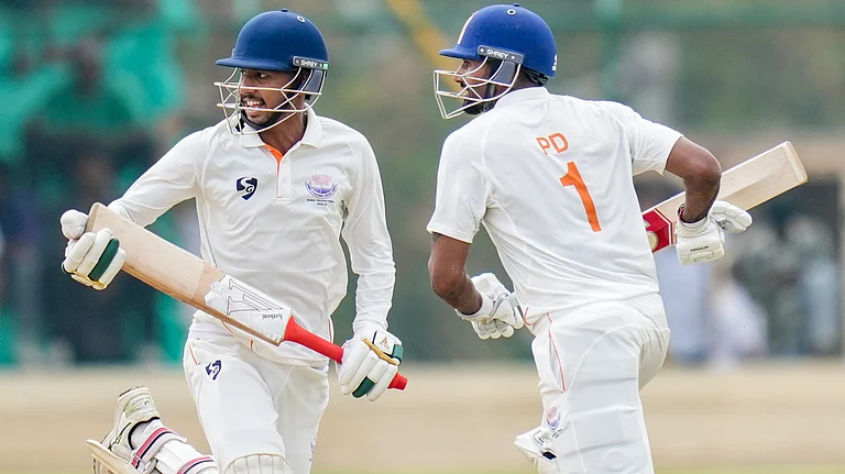 Jammu and Kashmir's captain Paras Dogra and teammate Kanhaiya Wadhawan run between the wickets during the second day of the Ranji Trophy 2025-26 final cricket match between Karnataka and Jammu and Kashmir, at KSCA Stadium, in Hubballi, Karnataka, Wednesday, Feb. 25, 2026. - | Photo: PTI/Shailendra Bhojak