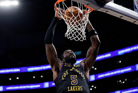Los Angeles Lakers center Deandre Ayton (5) dunks the ball during the second half of an NBA basketball game against the Orlando Magic, in Los Angeles.