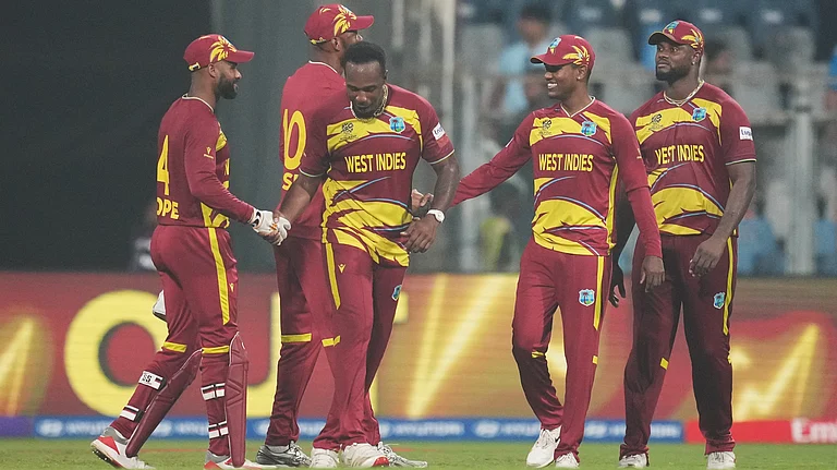 West Indies players celebrates after their win against Zimbabwe during the T20 World Cup cricket match in Mumbai, India, Monday, Feb. 23, 2026. - | Photo: AP/Rafiq Maqbool