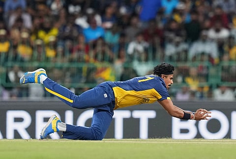 Sri Lanka's Maheesh Theekshana takes the catch to get New Zealand's Finn Allen during the T20 World Cup cricket match between Sri Lanka and New Zealand in Colombo, Sri Lanka.