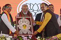 Modi Sounds Bengal Poll Bugle, Open Letter Invokes Maa Kali, Tagore, And Netaji IMAGO / Hindustan Times : PM Narendra Modi received an idol of Goddess Durga during the public rally at Singur, Hooghly district, on January 18, 2026 in Singur, India. PM Modi accused the TMC government of playing with national security by aiding infiltrators for vote-bank politics, and said it was necessary to end its maha jungle raj in West Bengal to pave the way for development and good governance.