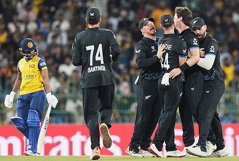 New Zealand's Matt Henry, centre, celebrates with teammates the wicket of Sri Lanka's Pathum Nissanka, left, during the T20 World Cup cricket match between Sri Lanka and New Zealand in Colombo, Sri Lanka.