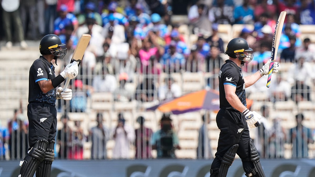 New Zealand's Glenn Phillips, right, celebrates his fifty runs during the T20 World Cup cricket match between Canada and New Zealand in Chennai, India, Tuesday, Feb. 17, 2026. - (AP Photo/Mahesh Kumar A.)