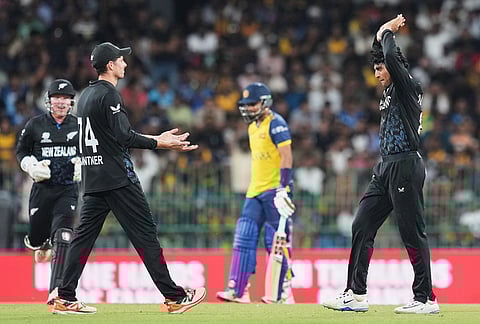 New Zealand's Rachin Ravindra, right, celebrates with teammates the wicket of Sri Lanka's captain Dasun Shanaka, centre, during the T20 World Cup cricket match between Sri Lanka and New Zealand in Colombo, Sri Lanka.