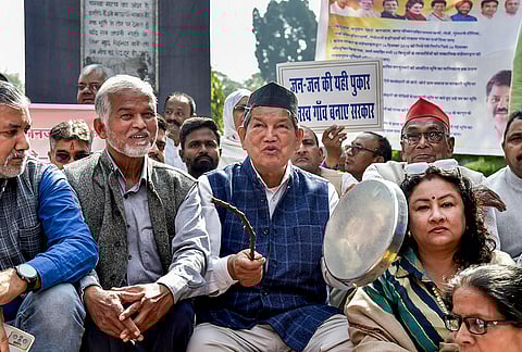 Congress leader Harish Rawat leads INDIA bloc parties during a protest against the Uttarakhand government's forest eviction policy, at Gandhi Park, in Dehradun.