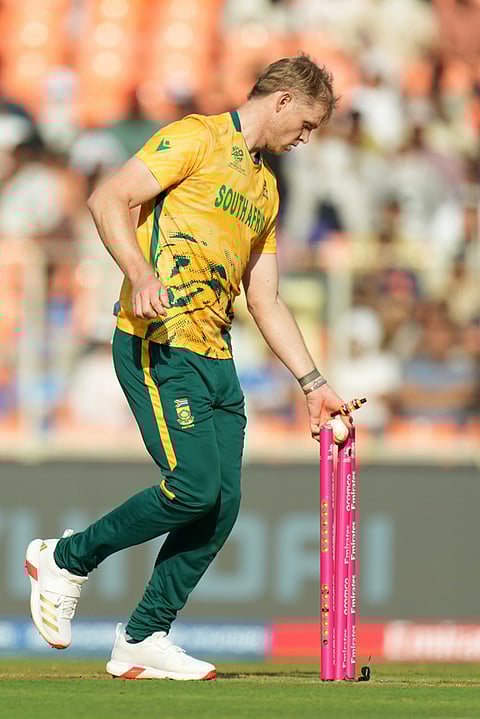 South Africa's Corbin Bosch takes the bails off to run West Indies' Jason Holder out during the T20 World Cup cricket match between South Africa and West Indies in Ahmedabad.