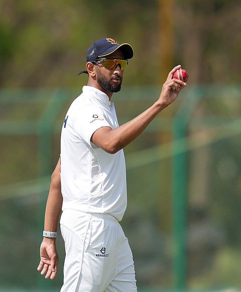 Karnataka's Prasidh Krishna displays the ball after taking five wickets during the third day of the Ranji Trophy 2025-26 final cricket match between Karnataka and Jammu and Kashmir at the KSCA Cricket Stadium, in Hubballi, Karnataka.