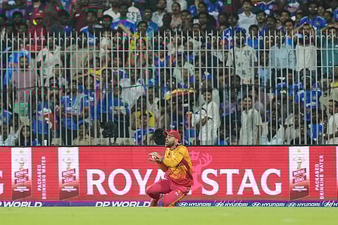 Zimbabwe's Ryan Burl takes the catch to dismiss India's Sanju Samson during the T20 World Cup cricket match between India and Zimbabwe in Chennai, India.