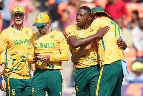 South Africa's Kagiso Rabada, second right, celebrates with teammate Marco Jansen the wicket of West Indies' Shimron Hetmyer during the T20 World Cup cricket match between South Africa and West Indies in Ahmedabad.