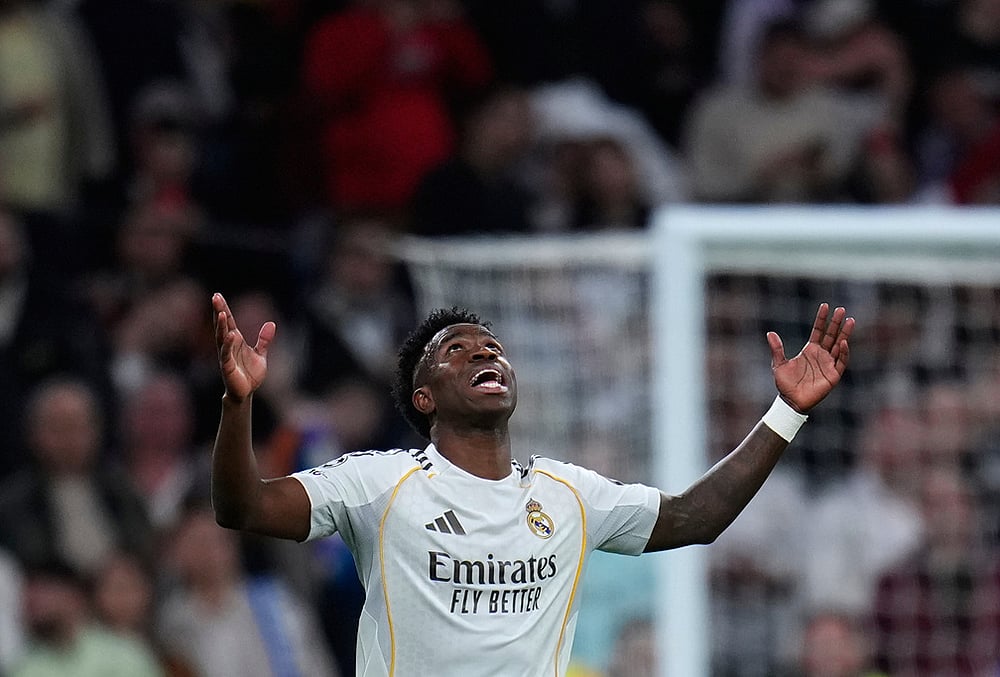 | Photo: AP/Manu Fernandez : Real Madrid's Vinicius Junior celebrates after scoring his side's second goal during the second leg of the Champions League playoff soccer match between Real Madrid and Benfica in Madrid, Spain.