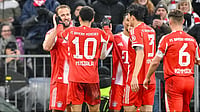 | Photo: dpa/Harry Langer via AP : Bayern Munich's Harry Kane, left, celebrates scoring with teammates during the Bundesliga soccer match between Bayern Munich and Eintracht Frankfurt in Munich, Germany, Saturday Feb. 21, 2026. 
