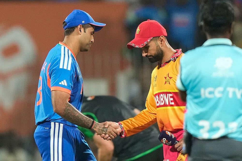 India's captain Suryakumar Yadav shakes hand with Zimbabwe's captain Sikandar Raza during the toss at the start of the T20 World Cup cricket match between India and Zimbabwe in Chennai, India. - | Photo: AP/Mahesh Kumar A.